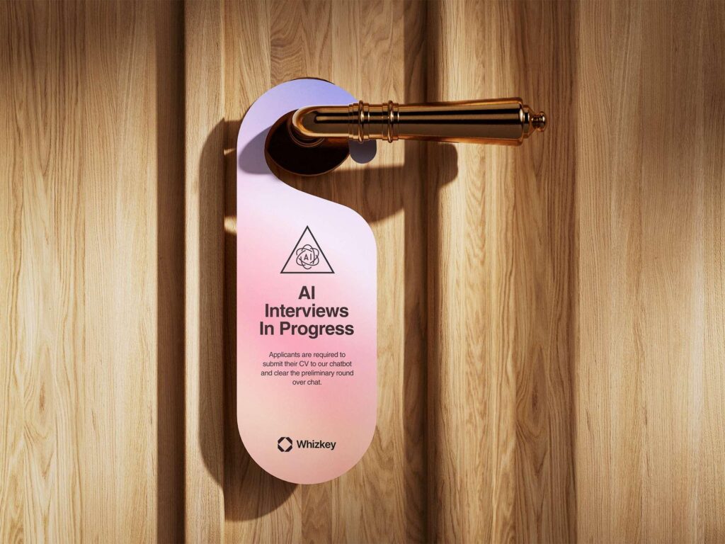 Door sign showing AI chatbot interviews in progress for HR recruitment in Kuwait