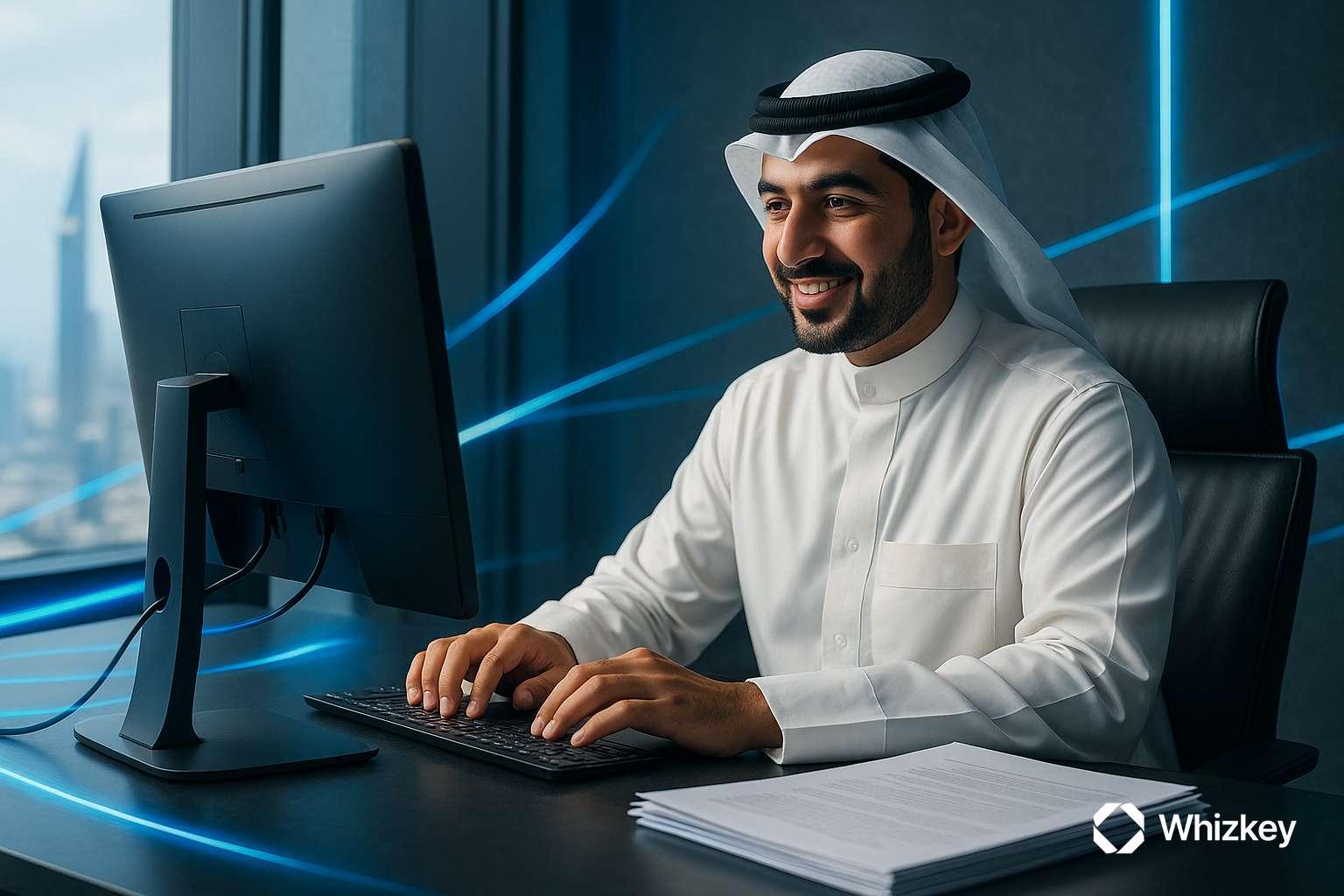 Kuwaiti employee working on computer with documents symbolizing compliance automation